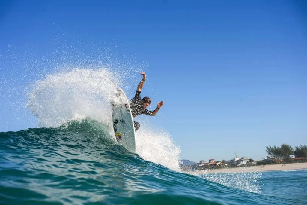 man surfing clear blue water