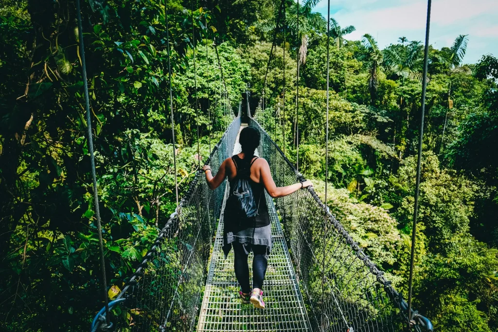 woman bridge jungle trek