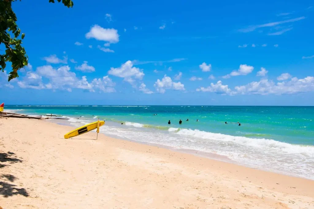 bahamas beach with surfers