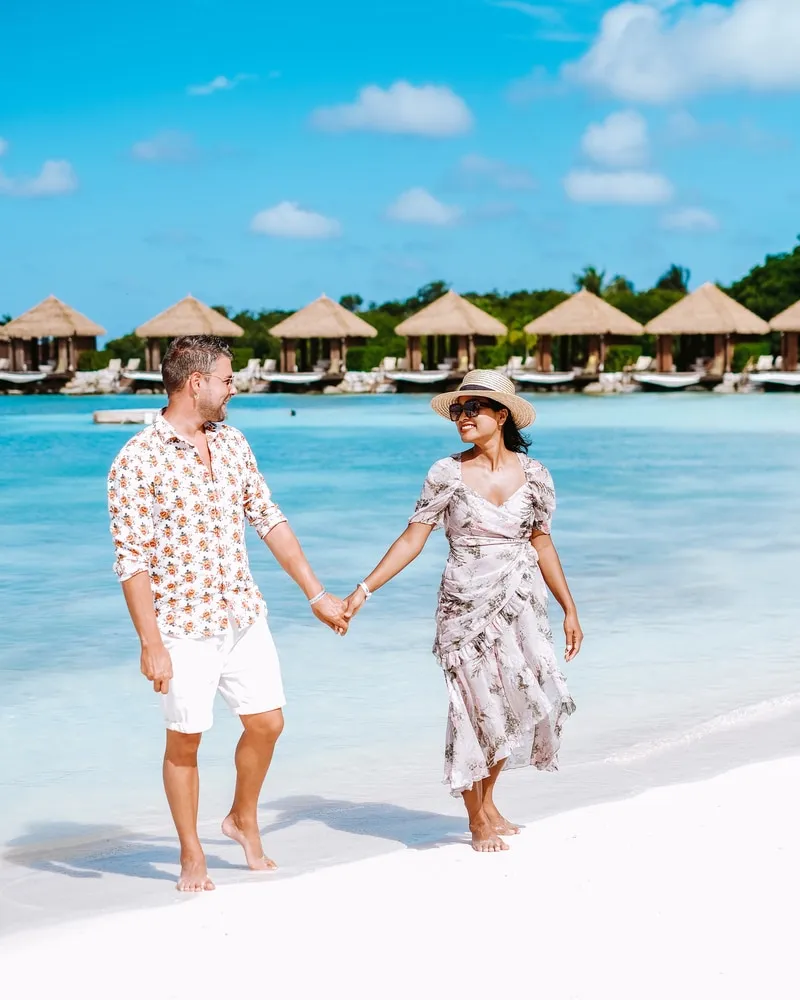 people walking on flamino beach aruba